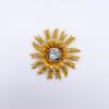Vintage brooch with feathered leaf wreath