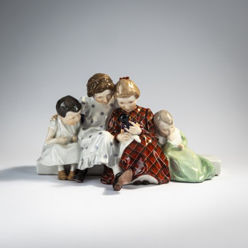 'Four children looking at a doll, sitting on a bench', 1906