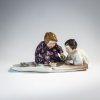 'Two children making sand molds', 1906 / before 1924
