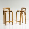 Two '65' bar stools, 1934