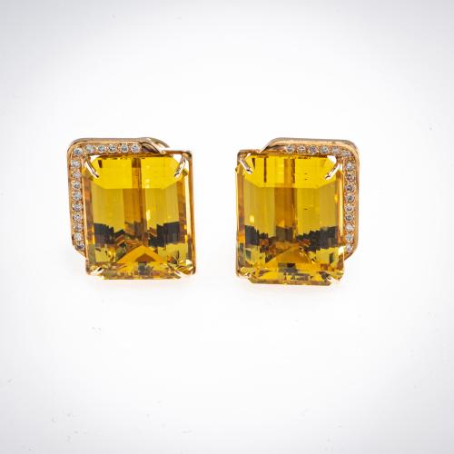 Pair of expressive ear clips set with two gold beryls and diamonds
