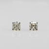 A pair of stud earrings set with Asscher-cut diamonds