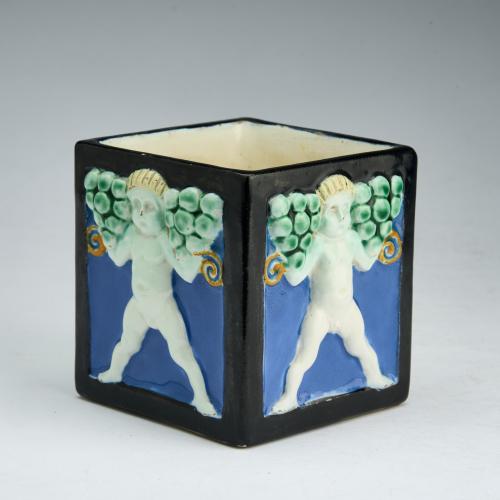Flower pot with four putti reliefs, 1907