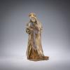 Female figure in a winter coat, c. 1900