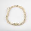Multi-strand pearl necklace with gold clasp