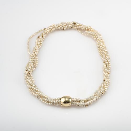 Multi-strand pearl necklace with gold clasp