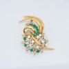 Floral brooch with emeralds and diamonds