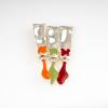 Brooch '3 red tubes', 1996