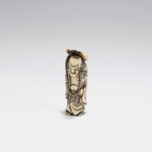 Netsuke. Elderly person with luggage, Gama Sennin ? 